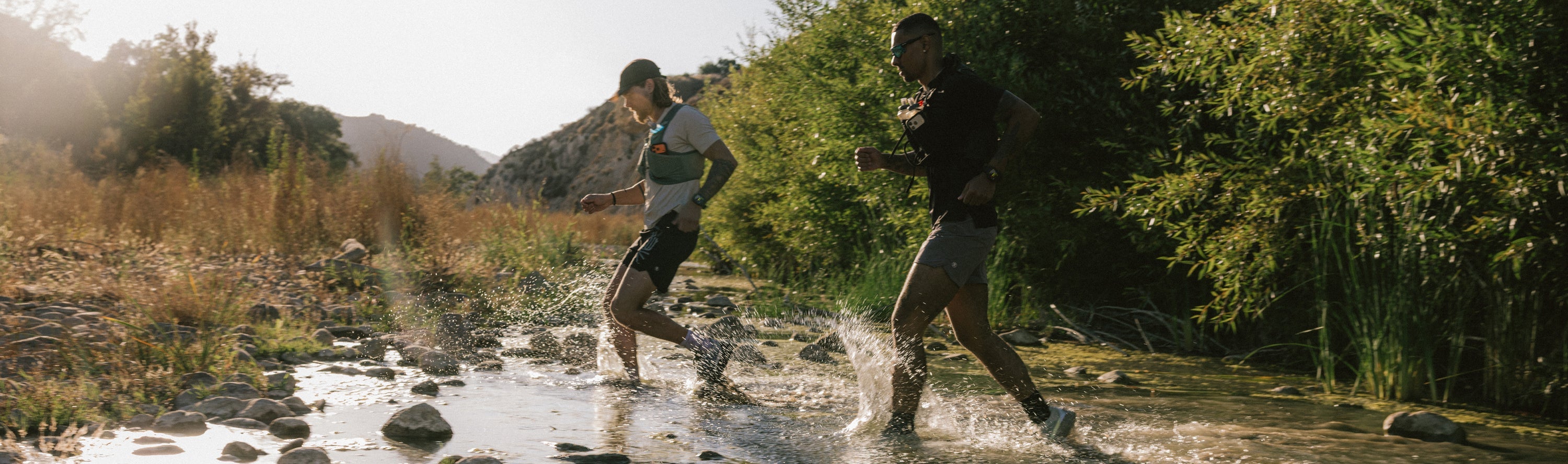 Nomads running through a stream